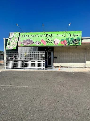 The shop front and open door seen from the car park